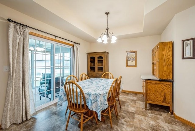 919 Deer Run Dr NE, Cedar Rapids, IA 52402 - dining area with a chandelier and a raised ceiling