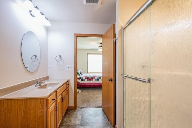 919 Deer Run Dr NE, Cedar Rapids, IA 52402 - bathroom with connected bathroom, vanity, a stall shower, and ceiling fan
