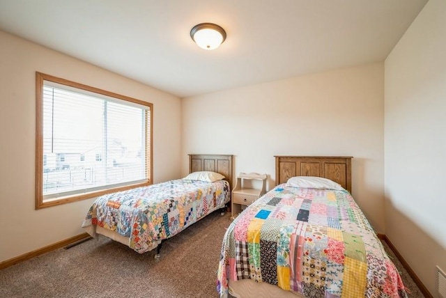 919 Deer Run Dr NE, Cedar Rapids, IA 52402 - bedroom featuring dark carpet and baseboards