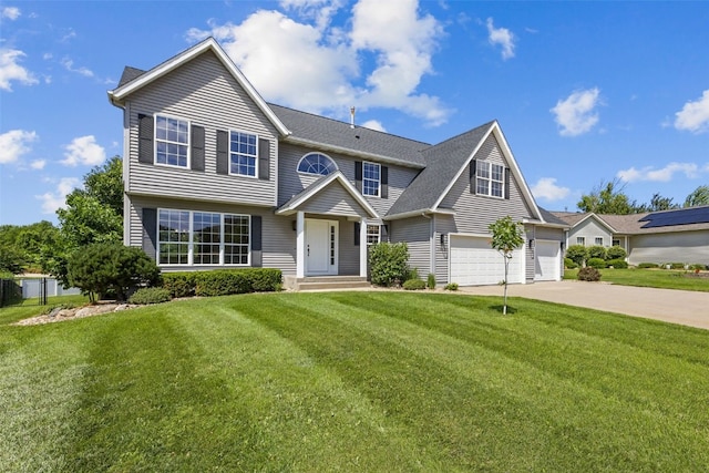 7603 Hampshire Dr NE, Cedar Rapids, IA 52402 - view of front of property featuring concrete driveway, a front lawn, a shingled roof, and an attached garage