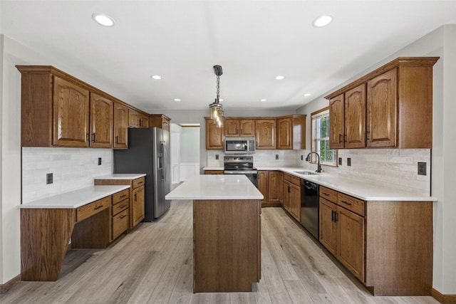 7603 Hampshire Dr NE, Cedar Rapids, IA 52402 - kitchen with stainless steel appliances, tasteful backsplash, a kitchen island, brown cabinets, and recessed lighting