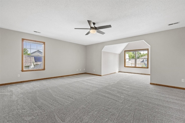 7603 Hampshire Dr NE, Cedar Rapids, IA 52402 - carpeted spare room with a ceiling fan and a textured ceiling
