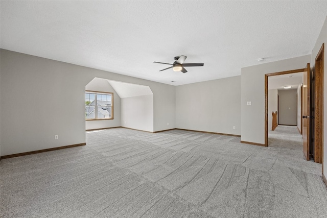 7603 Hampshire Dr NE, Cedar Rapids, IA 52402 - bonus room with a ceiling fan, light carpet, and a textured ceiling