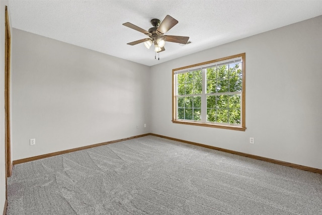 7603 Hampshire Dr NE, Cedar Rapids, IA 52402 - unfurnished room with carpet floors, a ceiling fan, and a textured ceiling
