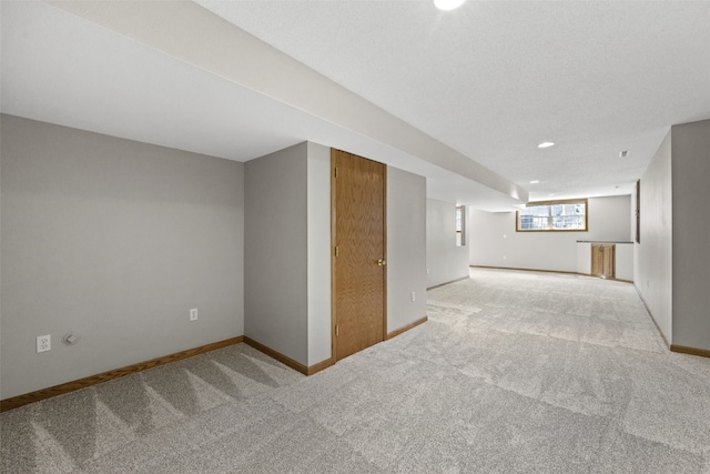 7603 Hampshire Dr NE, Cedar Rapids, IA 52402 - below grade area with light carpet and recessed lighting