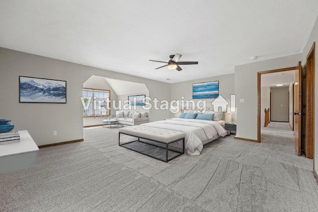 7603 Hampshire Dr NE, Cedar Rapids, IA 52402 - carpeted bedroom with a textured ceiling and a ceiling fan