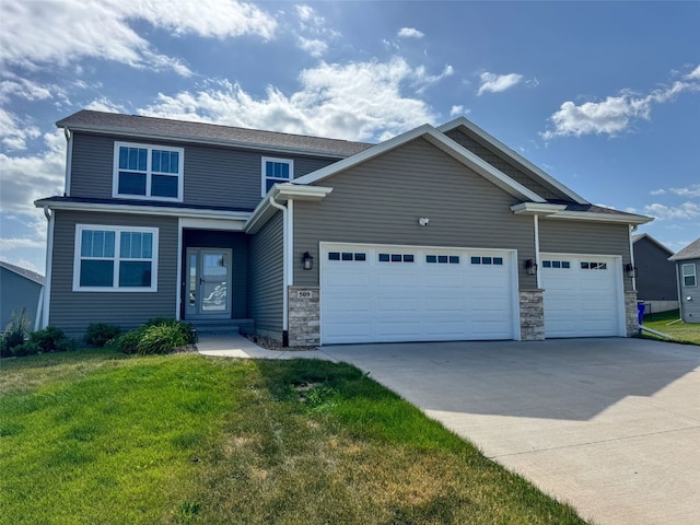 509 Grey Slate Dr SW, Cedar Rapids, IA 52404 - view of front facade with an attached garage, concrete driveway, a front lawn, and stone siding