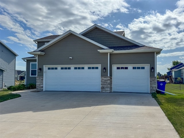 509 Grey Slate Dr SW, Cedar Rapids, IA 52404 - craftsman inspired home with stone siding, driveway, and an attached garage