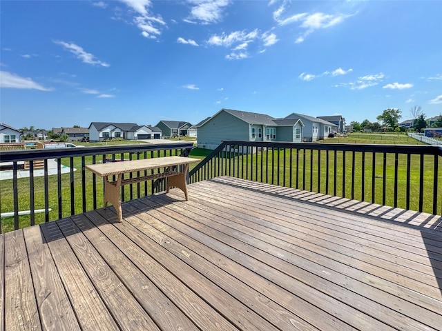 509 Grey Slate Dr SW, Cedar Rapids, IA 52404 - wooden deck featuring a residential view and a yard