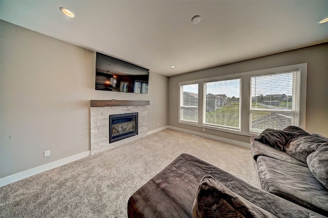 509 Grey Slate Dr SW, Cedar Rapids, IA 52404 - living area with carpet, plenty of natural light, a fireplace, and recessed lighting