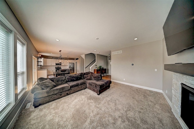 509 Grey Slate Dr SW, Cedar Rapids, IA 52404 - carpeted living room with a fireplace and recessed lighting