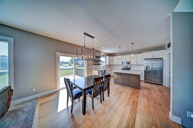 509 Grey Slate Dr SW, Cedar Rapids, IA 52404 - dining room featuring light wood-style flooring, recessed lighting, and a chandelier