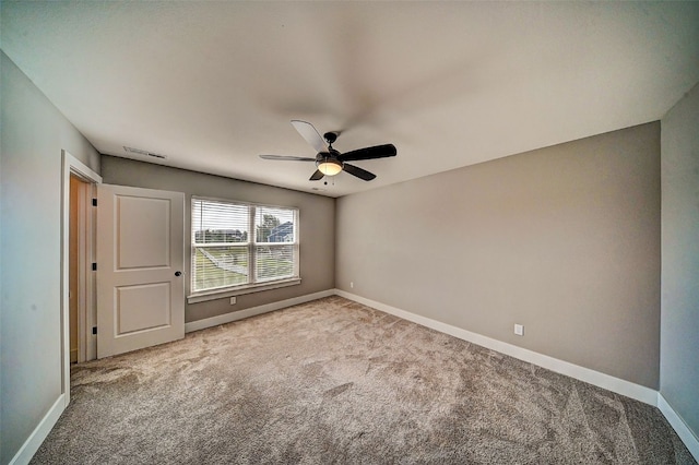 509 Grey Slate Dr SW, Cedar Rapids, IA 52404 - carpeted empty room featuring baseboards and a ceiling fan
