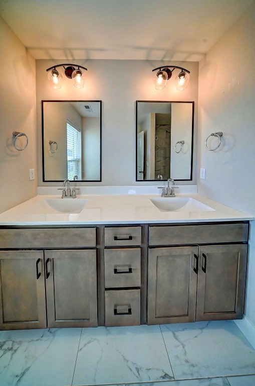 509 Grey Slate Dr SW, Cedar Rapids, IA 52404 - full bathroom with marble finish flooring and double vanity