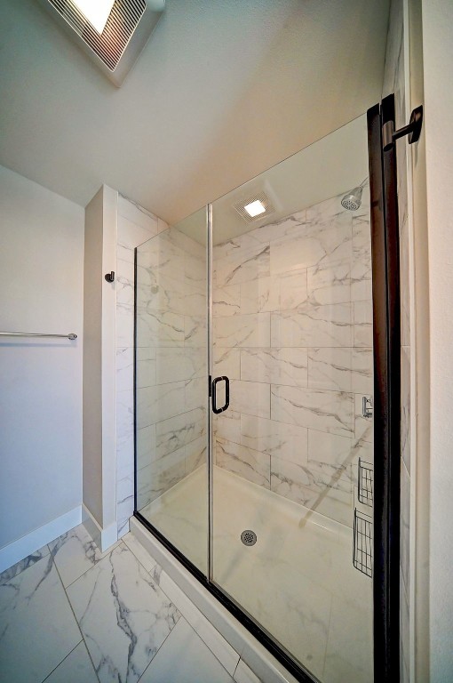 509 Grey Slate Dr SW, Cedar Rapids, IA 52404 - full bathroom with a marble finish shower and marble look tiles