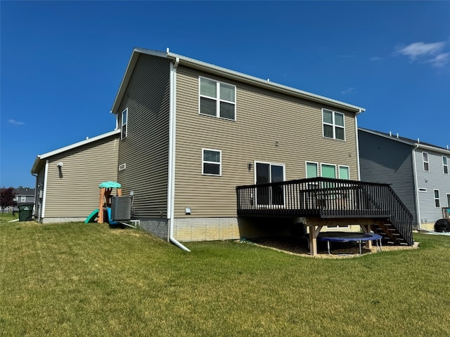 509 Grey Slate Dr SW, Cedar Rapids, IA 52404 - back of property with a wooden deck, a lawn, and stairs