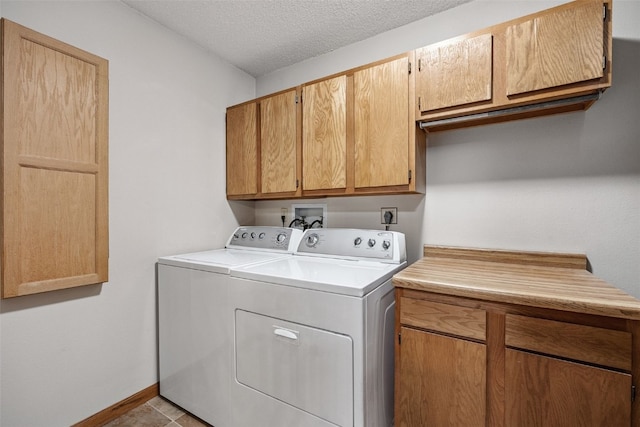 4725 Westchester Dr NE Unit C, Cedar Rapids, IA 52402 - laundry area featuring cabinet space, separate washer and dryer, and a textured ceiling