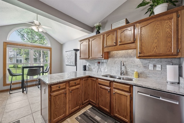 4725 Westchester Dr NE Unit C, Cedar Rapids, IA 52402 - kitchen featuring dishwasher, lofted ceiling, a peninsula, ceiling fan, and backsplash