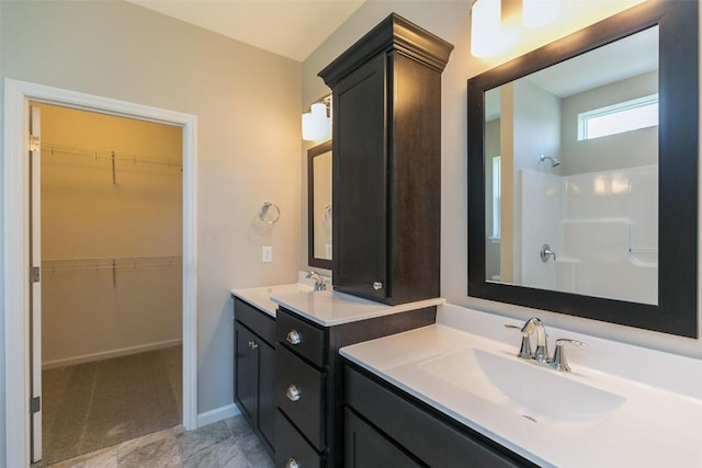 806 Crestview Dr, Solon, IA 52333 - full bathroom with vanity, a spacious closet, and a shower