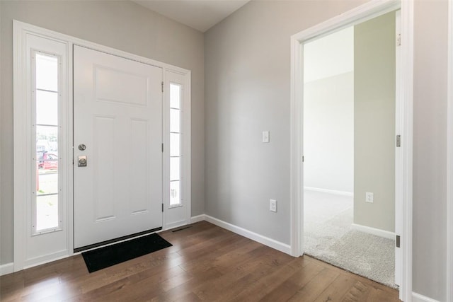 806 Crestview Dr, Solon, IA 52333 - entrance foyer with dark wood-style flooring and healthy amount of natural light