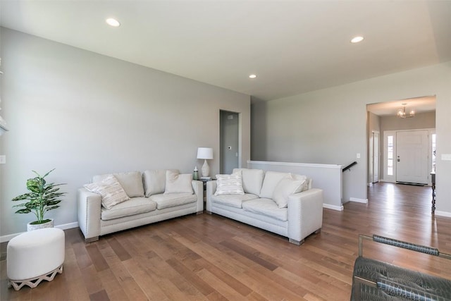 806 Crestview Dr, Solon, IA 52333 - living room featuring wood finished floors, a chandelier, and recessed lighting