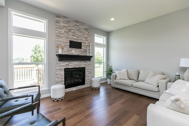 806 Crestview Dr, Solon, IA 52333 - living area featuring a fireplace, dark wood-style flooring, and recessed lighting