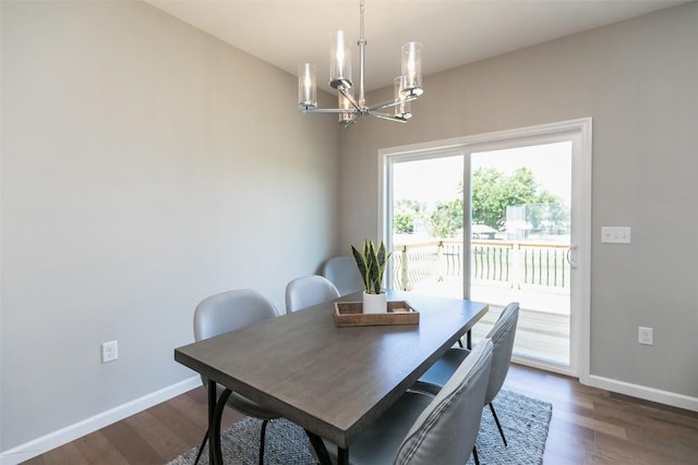 806 Crestview Dr, Solon, IA 52333 - dining space with a chandelier and dark wood-style floors