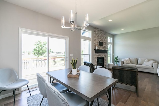 806 Crestview Dr, Solon, IA 52333 - dining area featuring a chandelier, a fireplace, wood finished floors, and recessed lighting