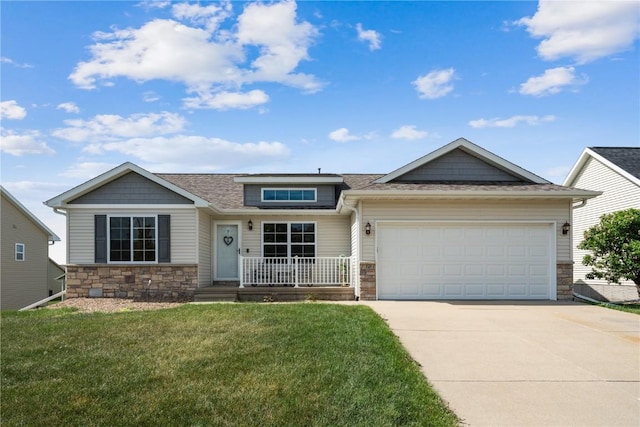 1301 Scarlet Sage Dr SW, Cedar Rapids, IA 52404 - view of front of property featuring stone siding, driveway, a garage, a front lawn, and roof with shingles