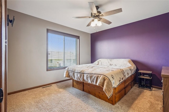 1301 Scarlet Sage Dr SW, Cedar Rapids, IA 52404 - carpeted bedroom with baseboards and a ceiling fan