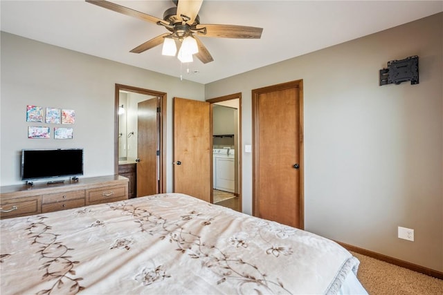 1301 Scarlet Sage Dr SW, Cedar Rapids, IA 52404 - bedroom with washing machine and clothes dryer, light colored carpet, ensuite bathroom, and a ceiling fan