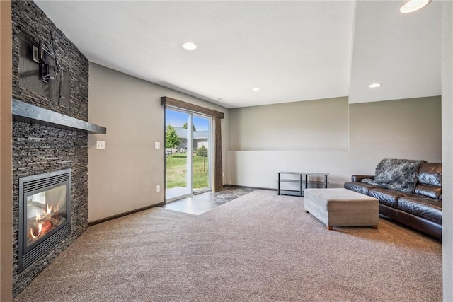 1301 Scarlet Sage Dr SW, Cedar Rapids, IA 52404 - living room featuring carpet floors, a stone fireplace, and recessed lighting