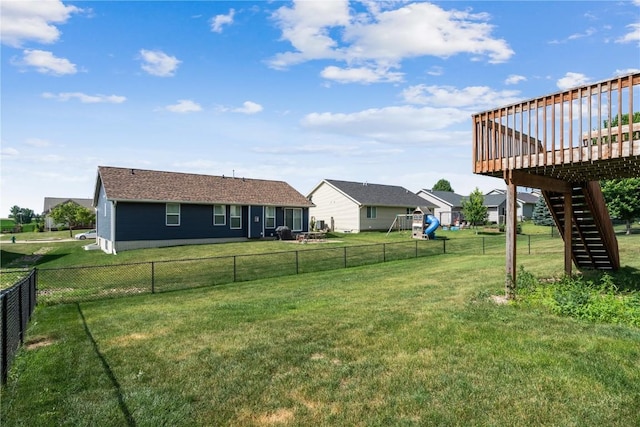 1301 Scarlet Sage Dr SW, Cedar Rapids, IA 52404 - view of yard with stairway, a playground, and a deck
