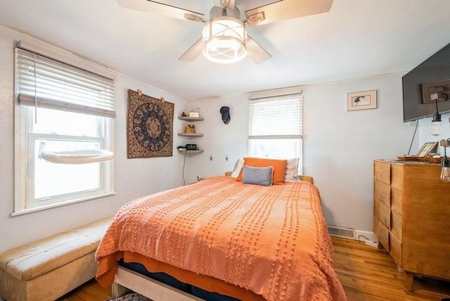 1120 23rd St, Cedar Rapids, IA 52403 - bedroom featuring wood finished floors and ceiling fan