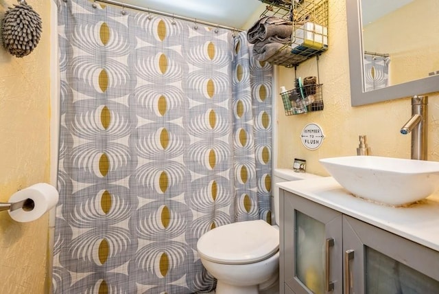 1120 23rd St, Cedar Rapids, IA 52403 - bathroom with a textured wall, vanity, and a shower with shower curtain