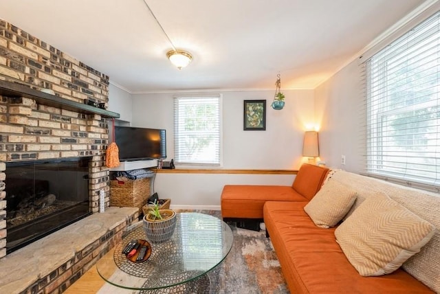 1120 23rd St, Cedar Rapids, IA 52403 - living room with crown molding and a brick fireplace