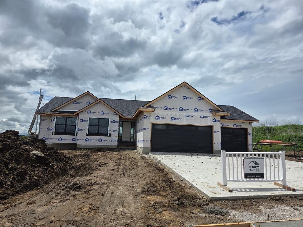 3339 Center Ct, Robins, IA 52328 - property under construction featuring a garage, driveway, and a shingled roof