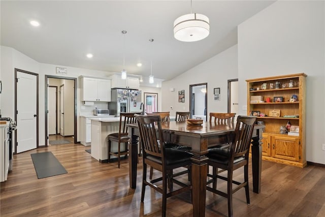 915 Prairie View Dr, West Branch, IA 52358 - dining space featuring dark wood-style floors, lofted ceiling, and recessed lighting