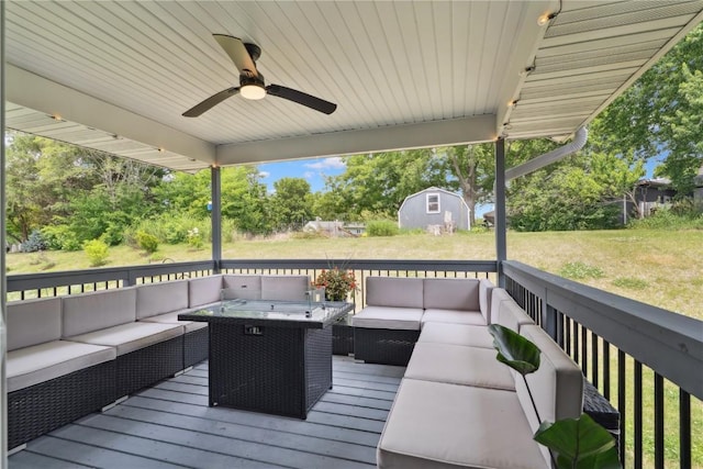 915 Prairie View Dr, West Branch, IA 52358 - deck featuring an outdoor hangout area, a ceiling fan, a shed, and a lawn