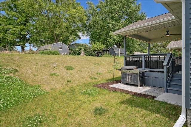 915 Prairie View Dr, West Branch, IA 52358 - view of grassy yard with a storage shed and ceiling fan