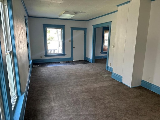 835 10th St SW, Cedar Rapids, IA 52404 - unfurnished room with dark carpet and crown molding