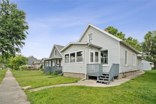835 10th St SW, Cedar Rapids, IA 52404 - view of home's exterior with a yard and a chimney