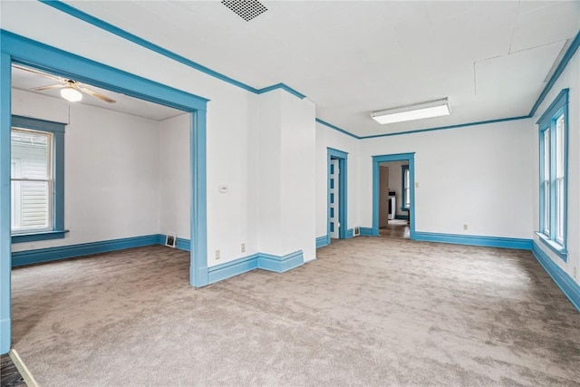 835 10th St SW, Cedar Rapids, IA 52404 - unfurnished room featuring carpet, baseboard heating, and ceiling fan