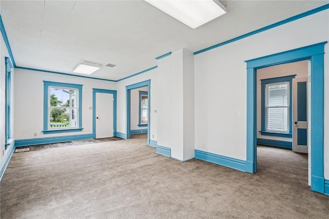 835 10th St SW, Cedar Rapids, IA 52404 - spare room with carpet flooring and baseboards