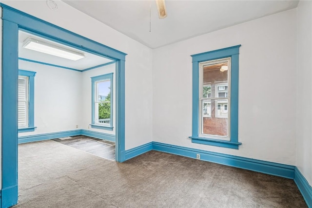 835 10th St SW, Cedar Rapids, IA 52404 - carpeted spare room featuring baseboards