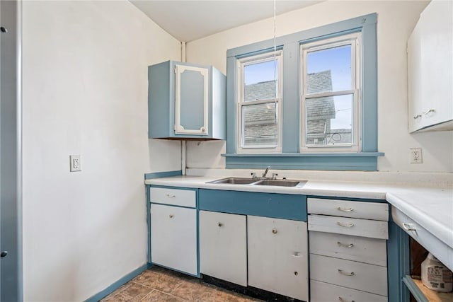 835 10th St SW, Cedar Rapids, IA 52404 - kitchen with light countertops and tile patterned floors
