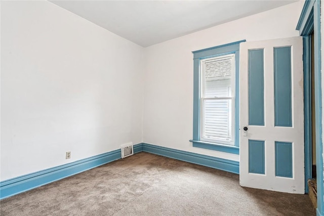 835 10th St SW, Cedar Rapids, IA 52404 - unfurnished room featuring carpet floors and baseboard heating