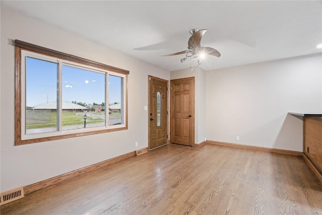 5315 E Ave NW, Cedar Rapids, IA 52405 - spare room featuring light wood-type flooring and a ceiling fan