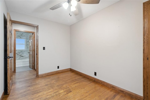 5315 E Ave NW, Cedar Rapids, IA 52405 - empty room with ceiling fan and light wood finished floors