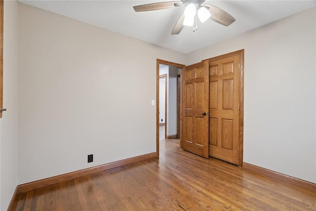 5315 E Ave NW, Cedar Rapids, IA 52405 - unfurnished bedroom featuring wood finished floors and a ceiling fan